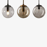 Applique murale avec boule en verre suspendue